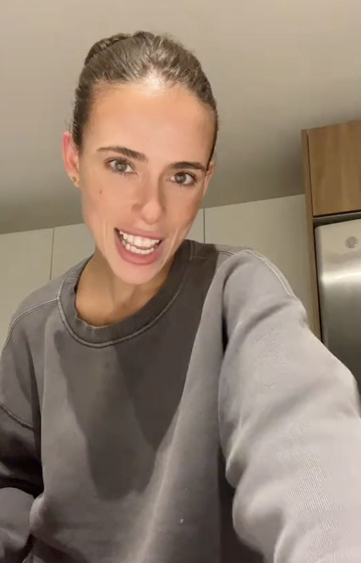 woman talking in her kitchen